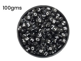 Cuentas plasticas pastilla negra letra blanca 